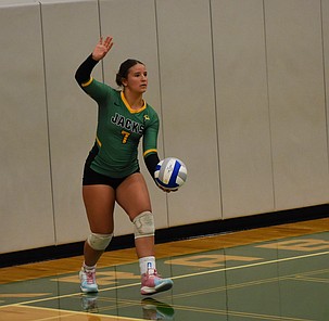 Quincy freshman Gabby Bergman steps up to serve the ball in their home matchup against Ephrata.