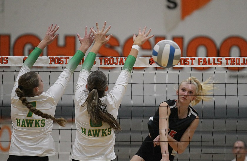 MARK NELKE/Press
Post Falls freshman Peyton Barclift hits line as junior Anabel Bowie (7) and sophomore Jaeli Hoffman (8) of Lakeland block on Tuesday night at The Arena at Post Falls.