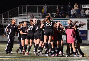 Knights players rush the field in celebration after winning in overtime PKs Tuesday against Naches Valley.