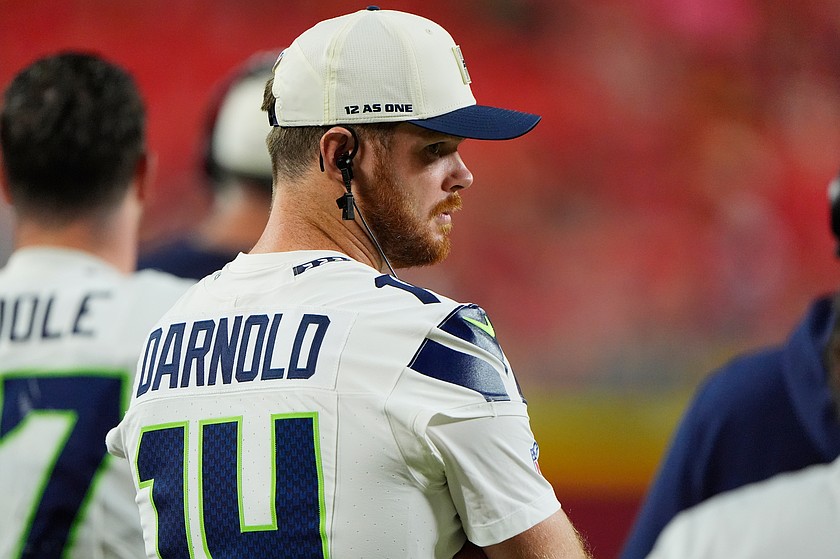 Seattle Seahawks quarterback Sam Darnold watches his teammates play during the second half of a preseason NFL football game against the Kansas City Chiefs, Friday, Aug. 28, 2026, in Kansas City, Mo. (AP Photo/Charlie Riedel)