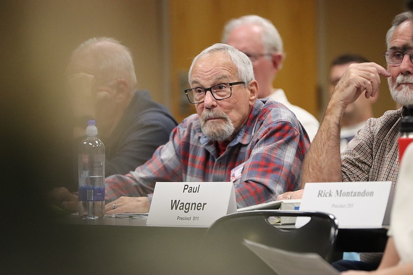 Gary Neill, who represents precinct 408 on the Kootenai County Republican Central Committee, listens to a speaker during Tuesday night's meeting at the Kootenai County administration building.