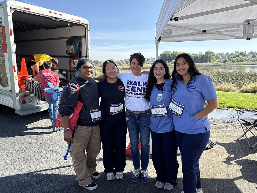 From left: CBTECH students Serenity Perez and Analii Luna, Walk to End Alzheimer’s organizer Karisti Cox and students Mia Guerrero and Zoe Meranda. The students were volunteering for the walk when they were called on to perform CPR and save a man’s life.