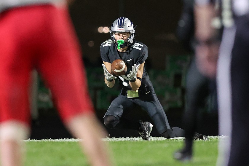 JASON DUCHOW PHOTOGRAPHY
Lake City junior Landon Leveque (14) hauls in a 14-yard touchdown pass in the fourth quarter against Sandpoint on Friday night at Van Troxel Field in Coeur d'Alene.