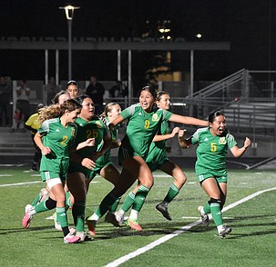 Jackrabbits players rush off the field with excitement after senior Jazmine Sanchez (25) scored the game winning goal in the last minute of OT.