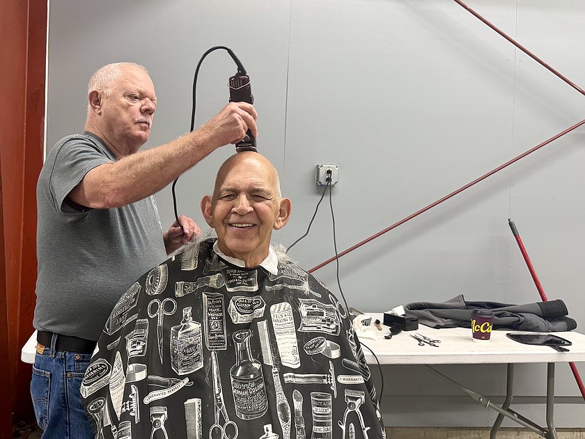 Richard Black receives a free haircut Saturday at the Grant County Veterans Resource Fair. Free haircuts were among the services offered to veterans throughout the event.