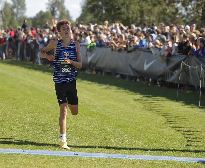 JASON ELLIOTT/Press
Coeur d'Alene junior Wyatt Morgenstern comes across the finish line in the boys elite race of the 49th annual Nike Bob Firman Invitational at The Course in Spokane Valley on Saturday.