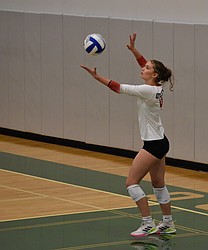 Huskies junior Julie Russell serves the ball during Thursday's game against the Jacks.