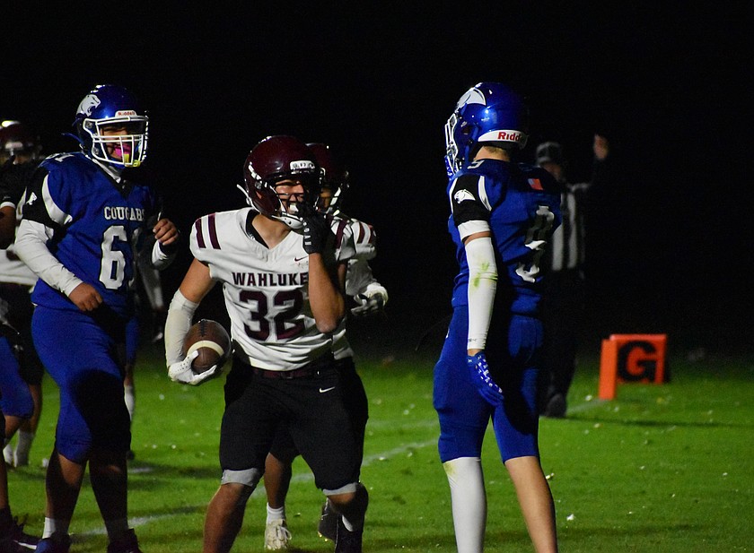 Franco Perez, a senior from the Warriors, celebrates in the endzone after rushing in for a touchdown against the Cougars.