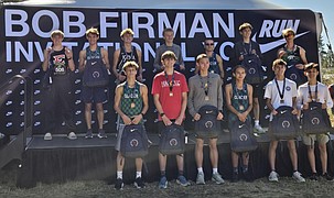 The Tigers boys cross country team takes a team photo following their success at the Nike invite. The boys team finished 26th overall.