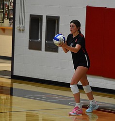 Evelyn Prows, a junior for Othello, gets ready to serve the ball during Tuesday's home game against Selah.