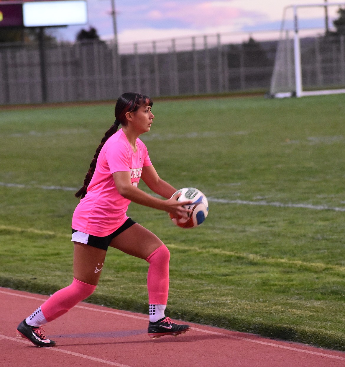 Elizabeth Garcia-Herrera, a sophomore from Othello prepares to throw the ball back into play Thursday evening.