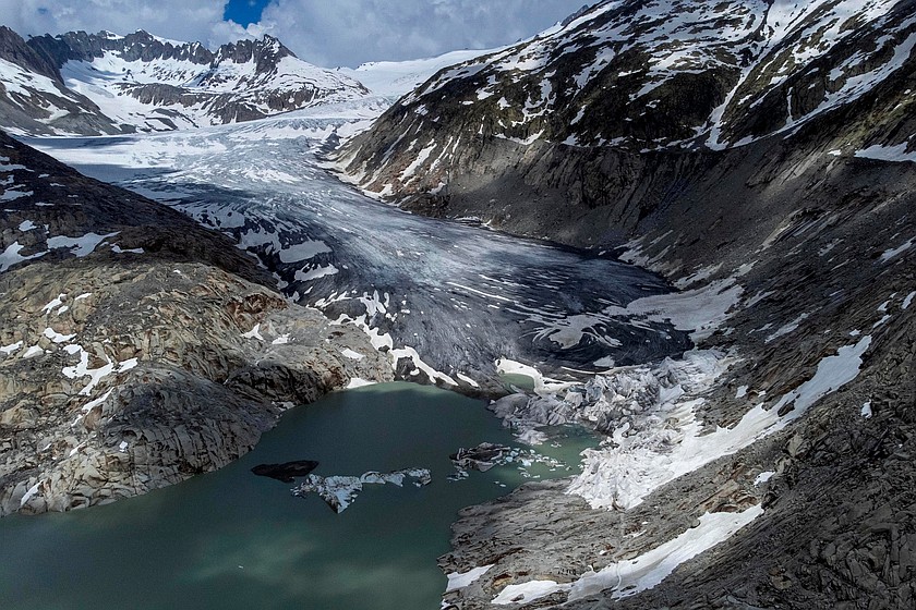 A lake of meltwater has formed on the tongue of the Rhone glacier near Goms, Switzerland, June 13, 2023. (AP Photo/Matthias Schrader, File)