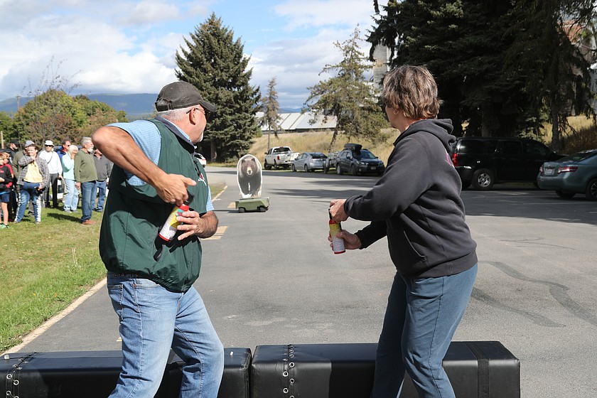 A Boundary County couple readies to deploy bear spray as they take part in bear safety training at Idaho Department of Fish & Game's annual Bear Fair on Saturday, Sept. 26.