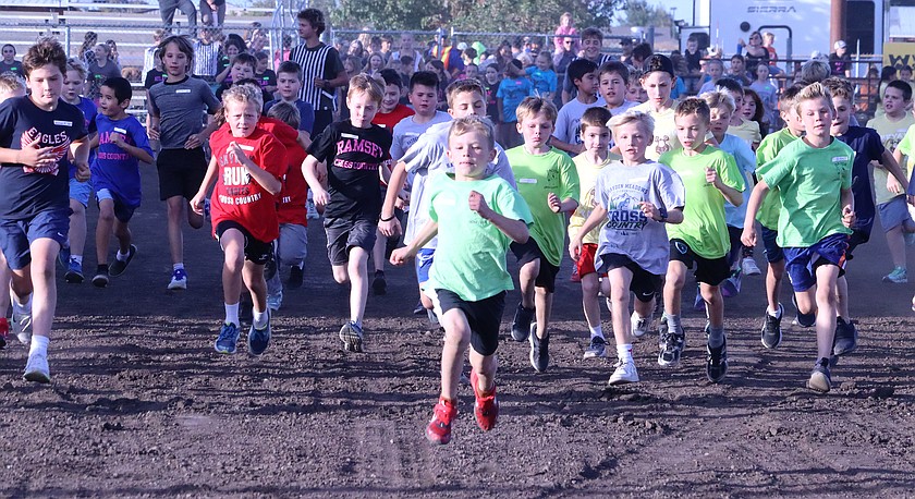 George Duke leads fourth-grade boys at the Coeur d'Alene School District's annual cross-country meet Thursday.