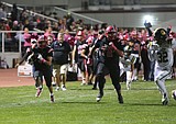 Gonzalez, Huskies ground game lead rout of Jacks