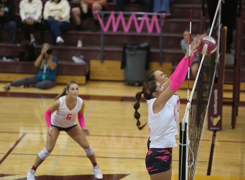 Hadley Whittall (6) and Hannah Crozier (7) block a spike from the Sunnyside attack Thursday. Moses Lake earned a hard fought 3-0 win over the Grizzlies.