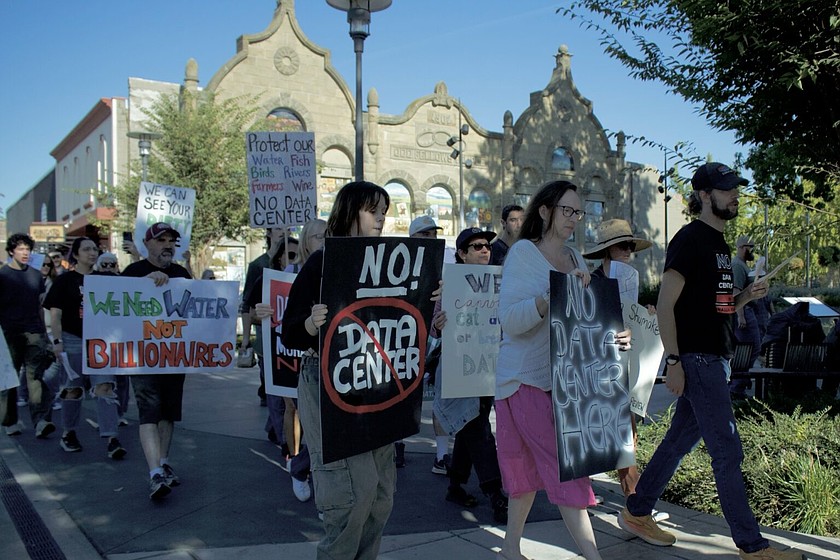 Roughly 40 people waved signs, chanted and marched Sunday during a Walla Walla demonstration demanding a data center moratorium.