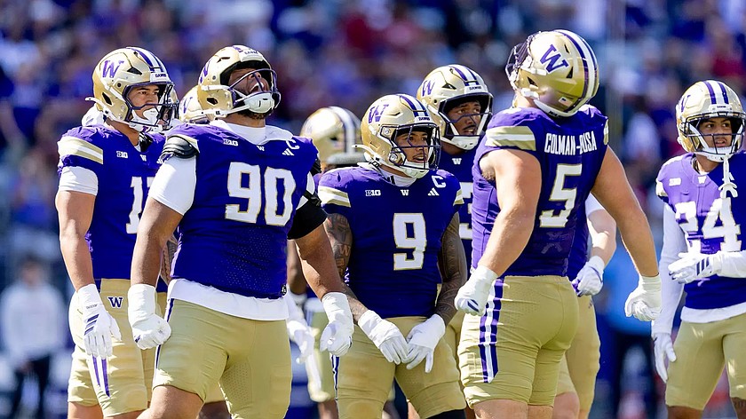 UW players get excited on the field earlier this season. The Huskies host Iowa for the first time in 63 years Friday at 6 p.m.