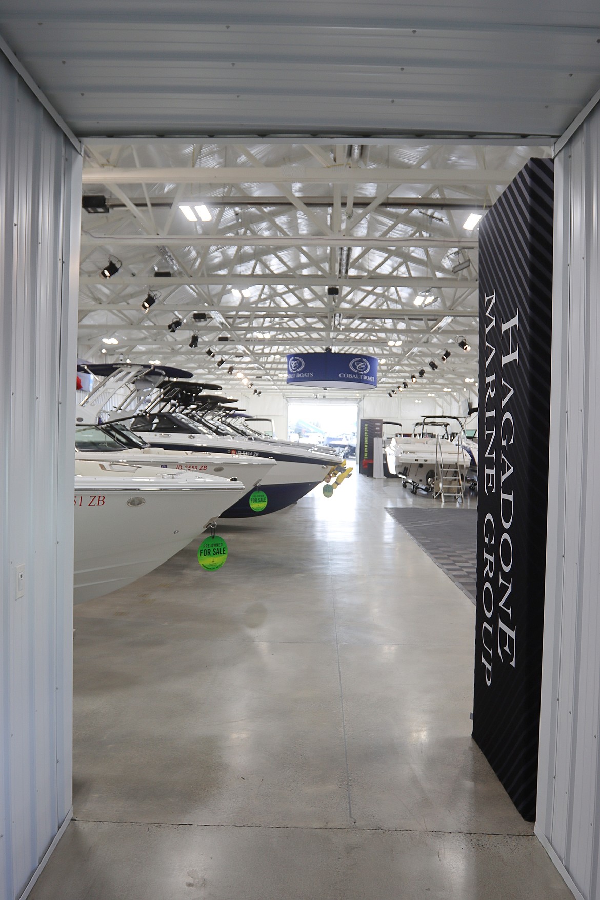 Boats await inside a Hagadone Marine Group showroom in Coeur d'Alene on Thursday.