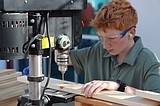 Pine Grove Academy students build bunk beds to benefit children