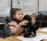 Cd’A first graders meet their 'Paws and Pages' buddies