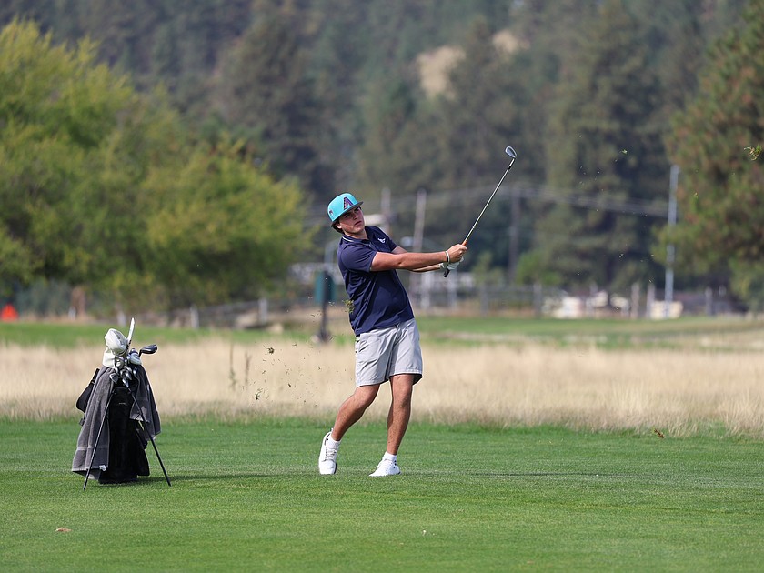 Courtesy photo
Lake City senior Trey Lambert hits a shot during the Lakeland Invitational on Sept. 24 at The Links Golf Club in Post Falls. Lambert tied a course record with a 10-under-par 63 during the match.