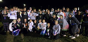 The Ephrata Tigers cross country team gathers for a photo following the Neon Nights meet in Selah. The Tigers girls finished first and the boys took second in their 5K events.
