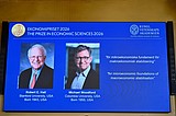 2 American economists win Nobel for work on managing economic shocks
