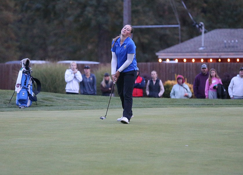 MARK NELKE/Press
Coeur d'Alene junior Ella Wilson sinks a birdie putt on the first playoff hole to win the state 6A girls golf championship Tuesday at Avondale Golf Club in Hayden.
