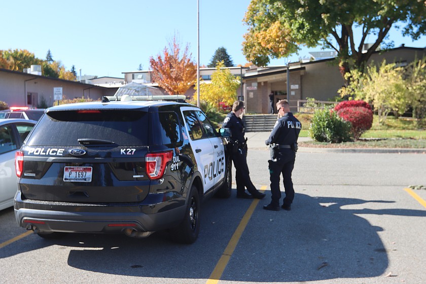 Coeur d'Alene Police officers stand outside of Venture Academy in Coeur d'Alene on Wednesday.