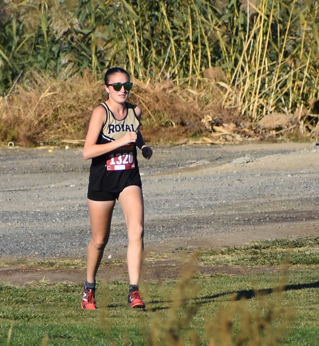 Knights junior Yanise Rincon jogs along Royal City Golf Course during Wednesday’s SCAC meet.