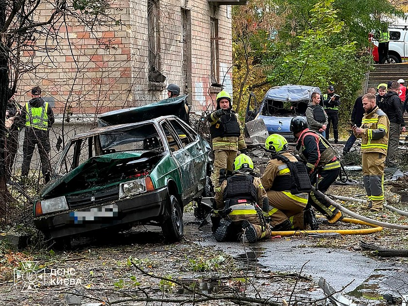 In this photo provided by the Ukrainian Emergency Service, emergency services personnel work in residential neiboorhud following a Russian air attack in Kyiv, Ukraine, Thursday, Oct. 15, 2026. (Ukrainian Emergency Service via AP)