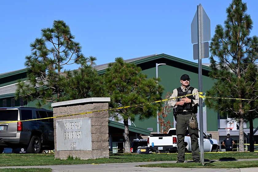 Police tape is placed outside Silver Rail Elementary school, where a shooting took place, on Thursday, Oct. 15, 2026 in Bend, Ore. (AP Photo/Joe Kline)