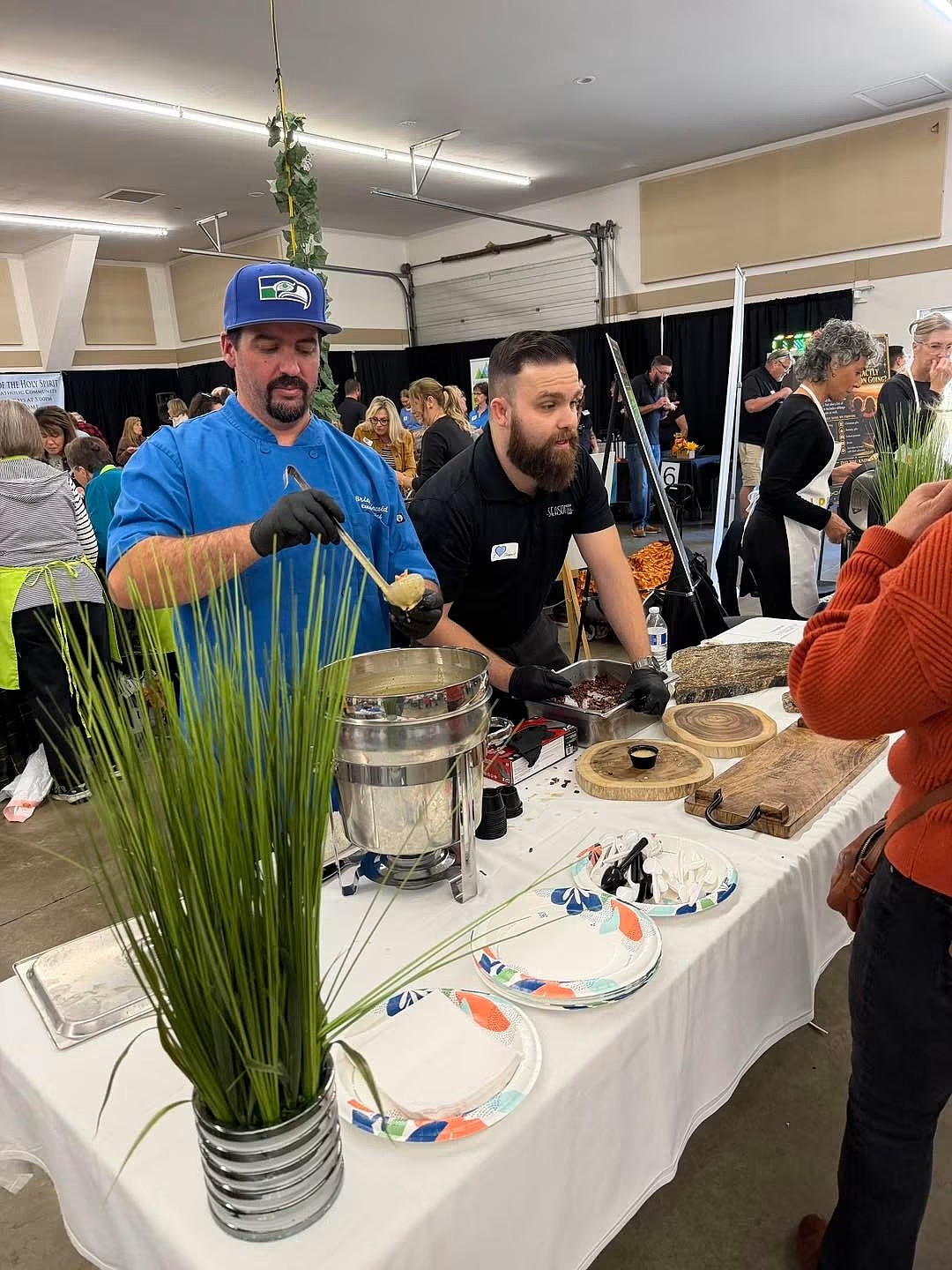 Soup Chef Brian Sacco from Seasons of Coeur d'Alene serves a guest at St. Vincent de Paul North Idaho's "Souport the End of Homelessness" on Thursday.