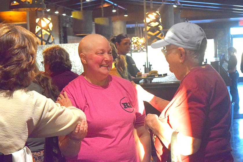 Joy Fry talks with Joan Green at Rock Top Burgers & Brew during the “Joy Celebration” Thursday. Rock Top, throughout the rest of October, will be raising funds for the Columbia Basin Cancer Foundation.