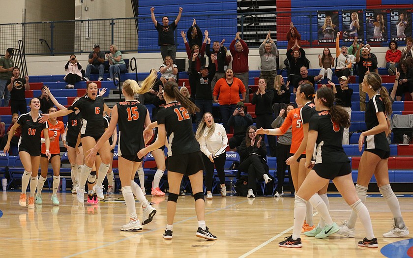 MARK NELKE/Press
The Post Falls Trojans and their fans celebrate after beating the Coeur d'Alene Vikings to win the 6A District 1 volleyball championship Saturday at Viking Court.