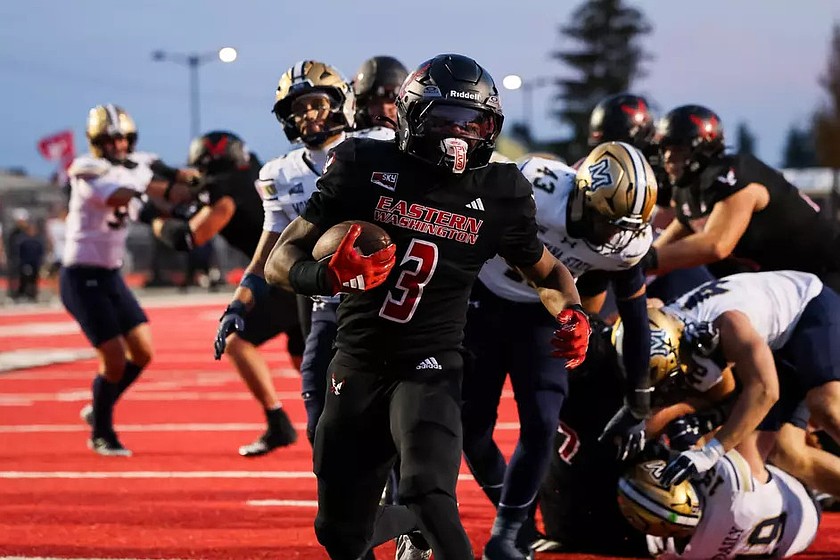 The Eagles’ Kevin Allen III (3) breaks through the front line for an Eastern Washington touchdown against Montana State on Saturday.