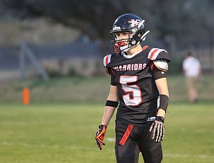 The Warriors’ Trey Kast (5) lines up on defense during a previous game this season. The Almira/Coulee-Hartline Warriors won their seventh straight with a 58-6 rout over Wilbur-Creston-Keller on Friday.