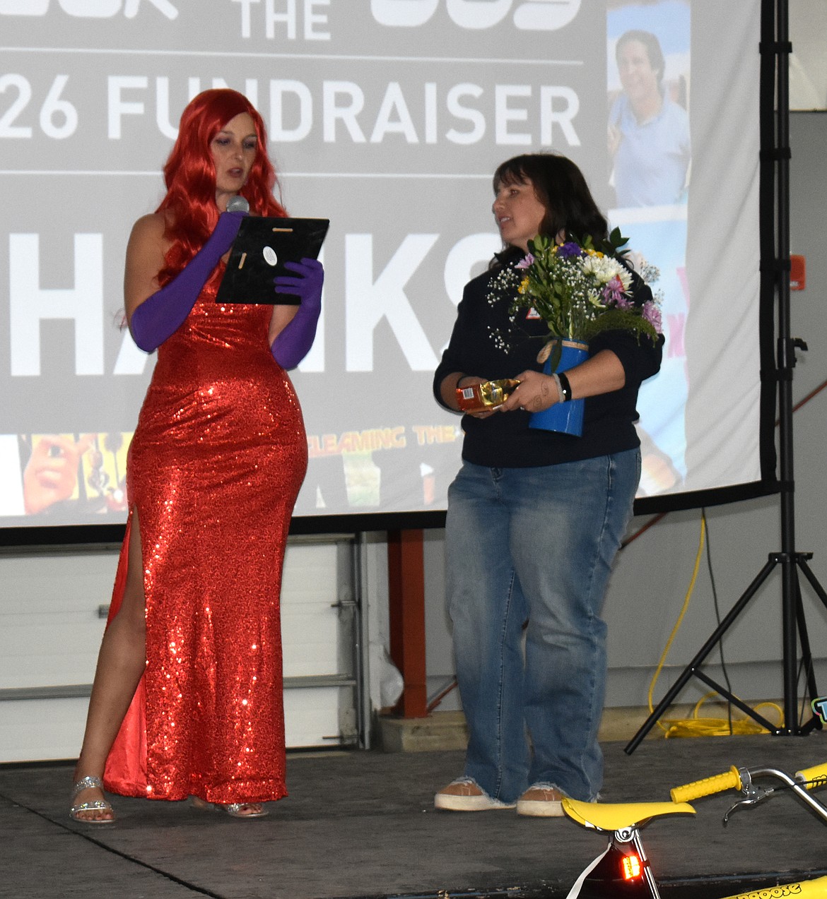 Shawna Sloane gives Yvonne Juergens an award for countless hours of volunteer work and unflagging support.