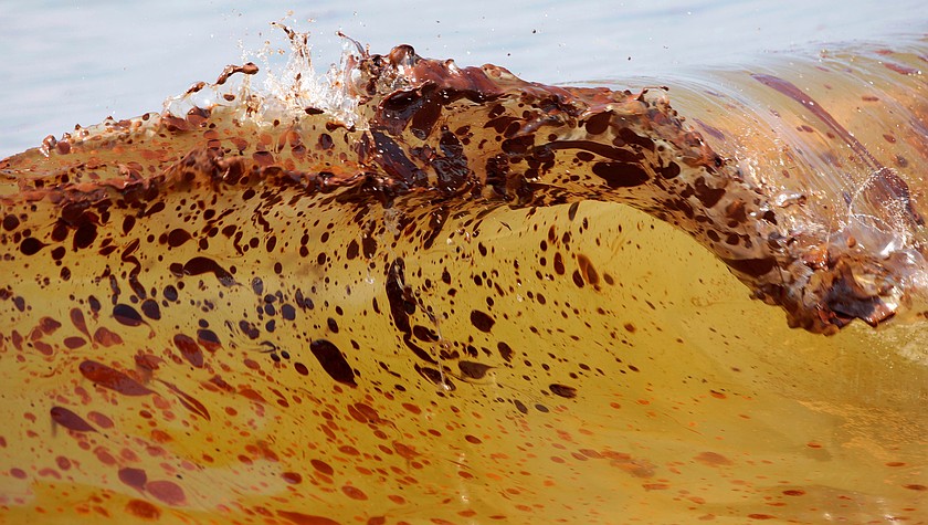 Crude oil from the Deepwater Horizon oil spill washes ashore in Orange Beach, Ala., June 12, 2010. (AP Photo/Dave Martin, File)