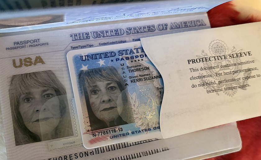 Kerri Thoreson's new passport and passport card, featuring a smileless photo.