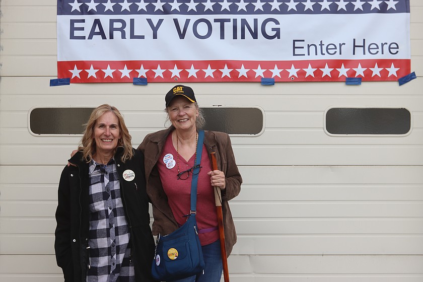 Marsha Becker and Mia Groth proudly display their "I Voted" stickers after casting their vote on the first day of early voting on Monday.
