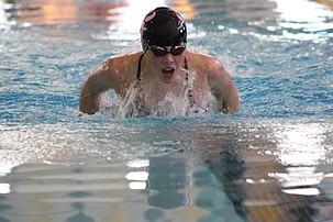 Kimball Roylance from the Mavs comes up for air while making her laps across the pool in Thursday’s meet.