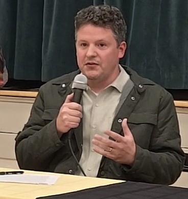 Luke Mayville, an executive director of Reclaim Idaho, speaks in Coeur d'Alene on Monday.