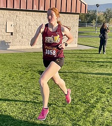 Rachel Nofziger from the Mavs rushes ahead of the crowd during Tuesday's league meet in Wenatchee.