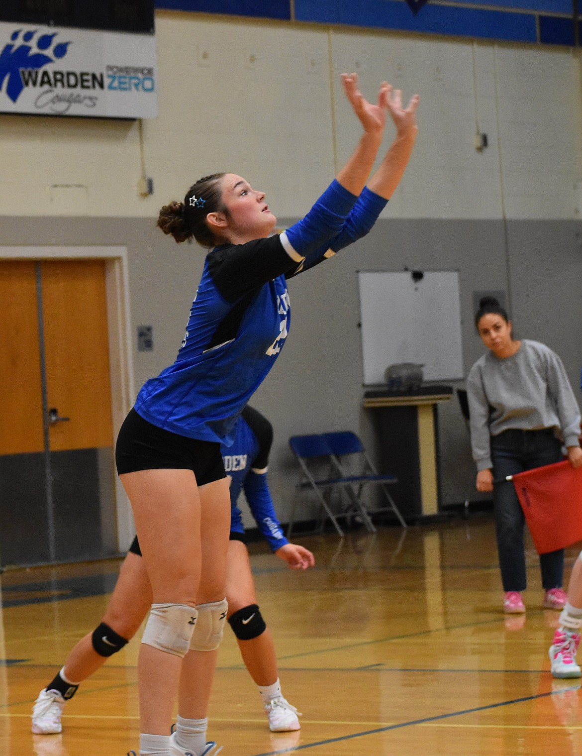 Brittney Cole, a junior from Warden, bumps up a serve from Tri-Cities Prep Tuesday evening.