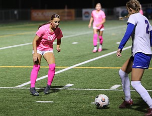 The Mavs' Ariah Loiseau (13) guards an Eisenhower player closely during their game Tuesday. Moses Lake fell 2-0 in a gritty battle with the Cadets.