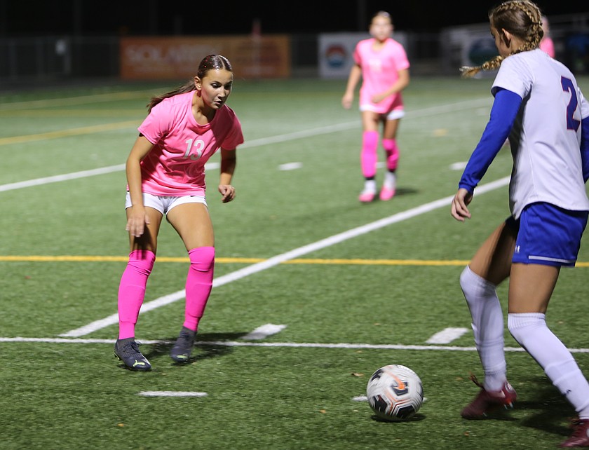 The Mavs' Ariah Loiseau (13) guards an Eisenhower player closely during their game Tuesday. Moses Lake fell 2-0 in a gritty battle with the Cadets.