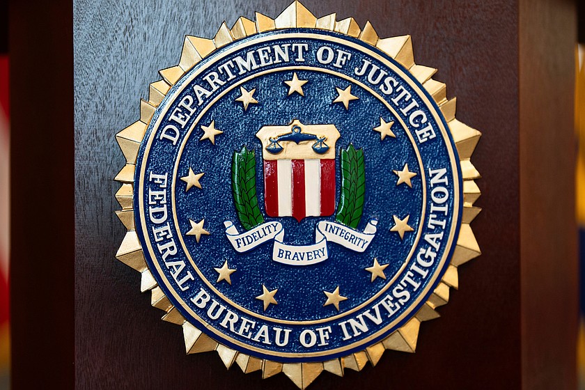 An FBI seal is displayed on a podium before a news conference at the field office in Portland, Ore., Jan. 16, 2025. (AP Photo/Jenny Kane, File)