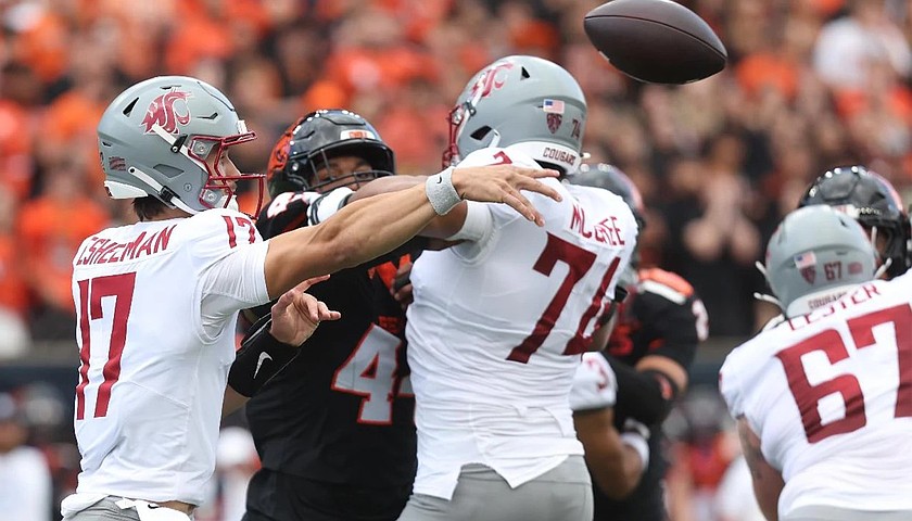 Cougars quarterback Owen Eshelman makes a pass thanks to the blocking from his teammate Maximus McCree during last week's game against Oregon State. WSU hosts Boise State this Saturday.
